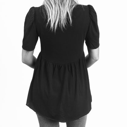 black cotton modal medium length puff sleeve babydoll tee back view on model